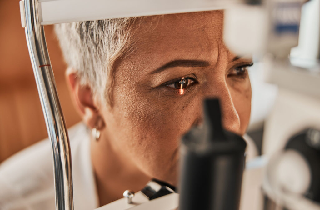 Senior woman being examined with a slit lamp.