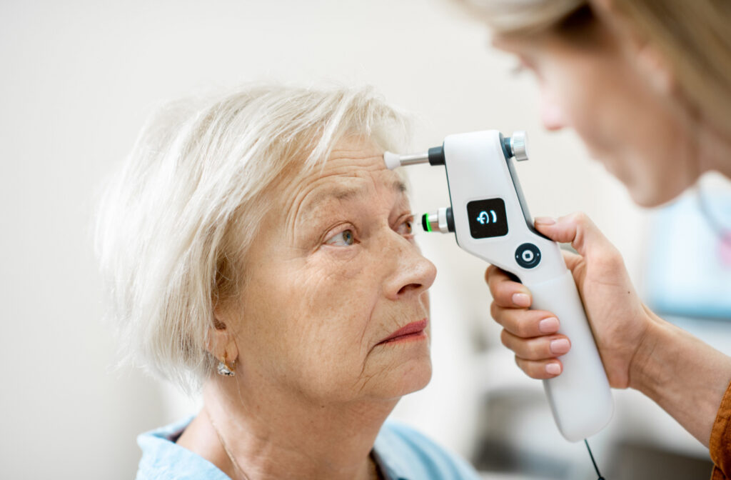 Senior woman has her eye pressure tested.
