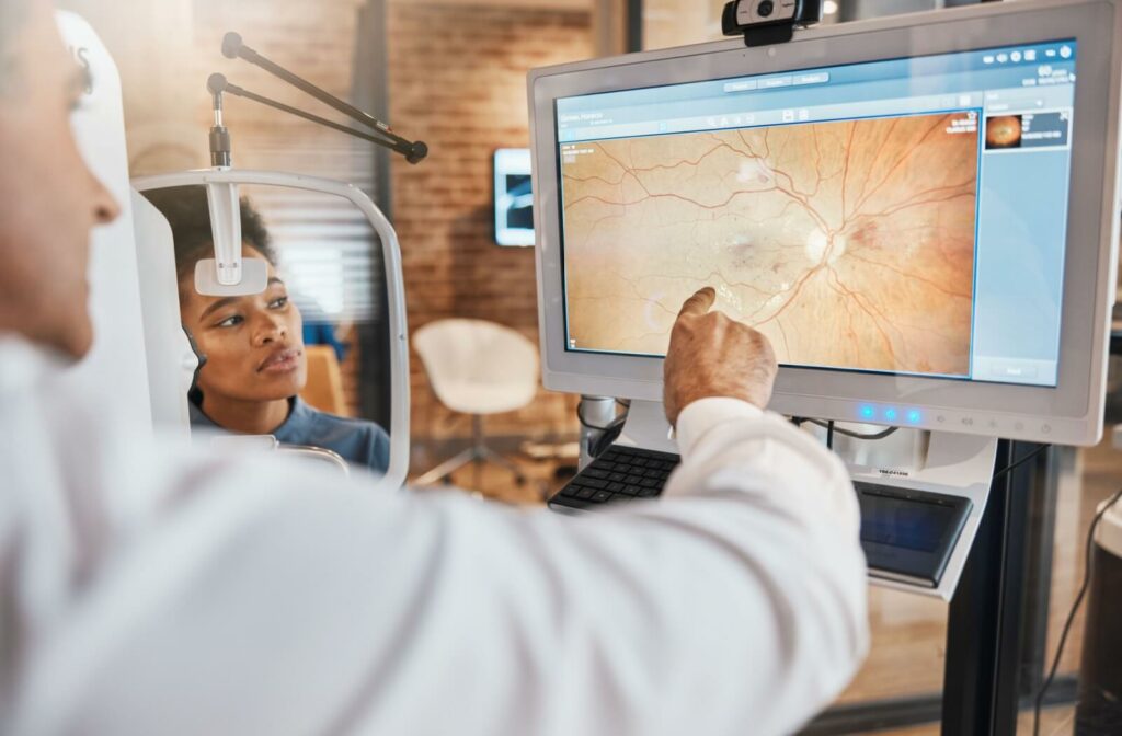 An optometrist explains the findings of their patient's retinal images from their routine eye exam.