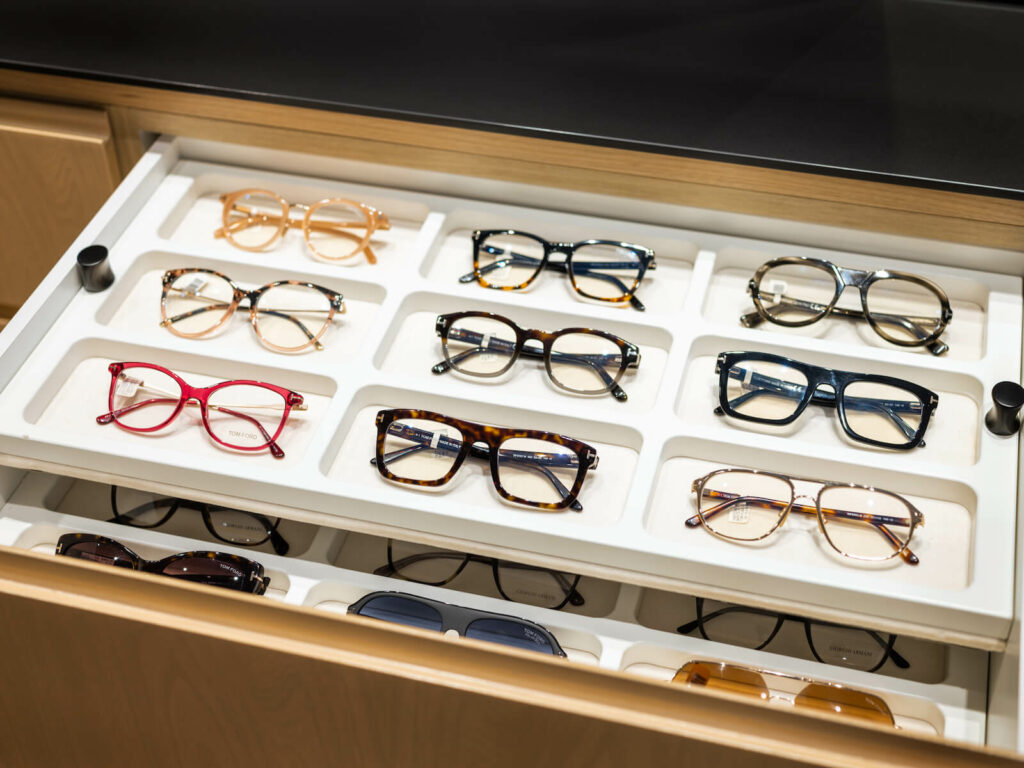 A pulled out drawer at Downtown Vision Care displaying Tom Ford glasses.