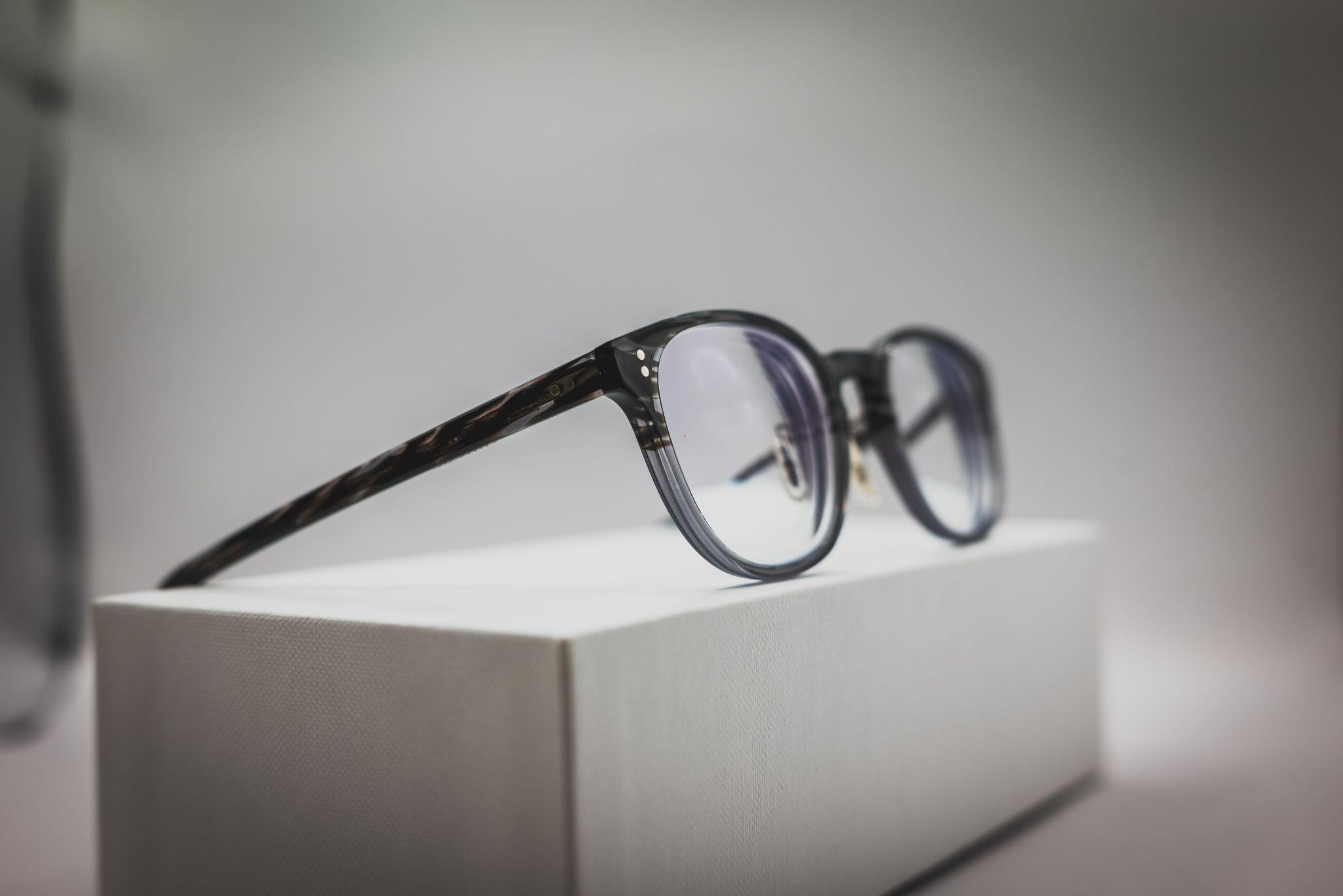 High index glasses resting on a block.